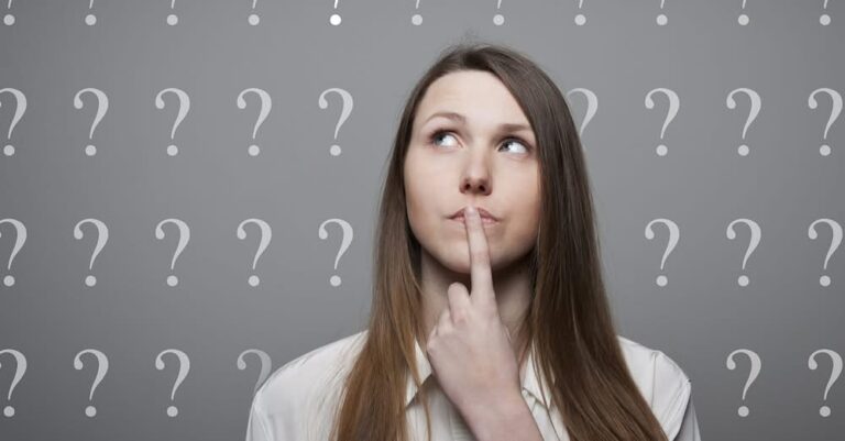 Girl full of doubts and hesitation. Girl and many question marks above head.